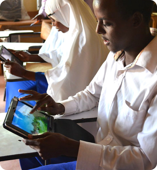 Students learning with tablets in a classroom